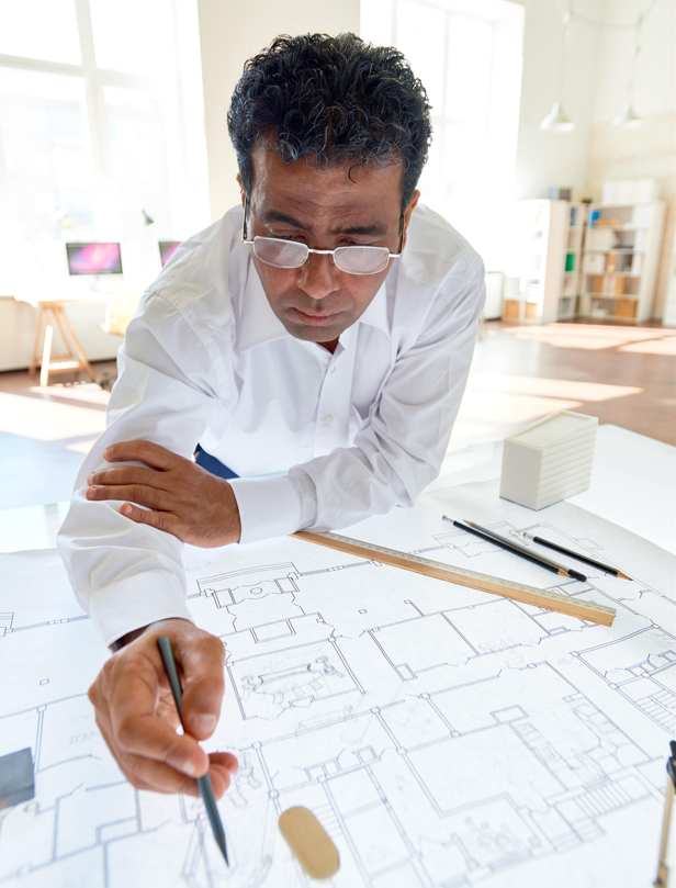 Image of a man studying architectural plans